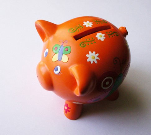 A decorative piggy bank. Best Collateral's interest free layaway program.