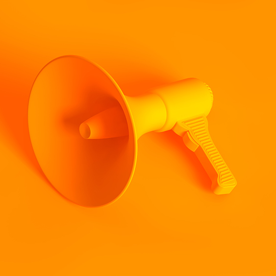 A yellow loudspeaker on a matching yellow background