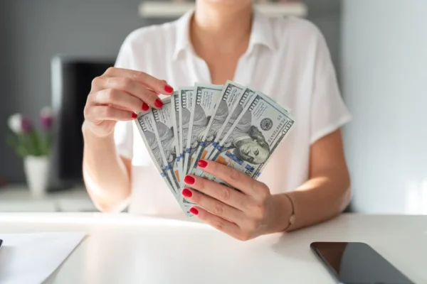 Woman Hands Holding Dollar Bills