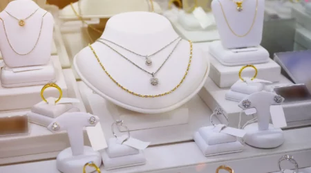 jewelry diamond gold shop with rings and necklaces luxury retail store window display showcase
