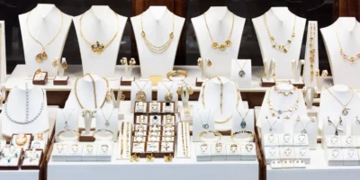 Pendants and bracelets with dimonds on display of jewelry store