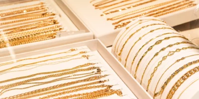 gold chains and bracelets on jewelry display