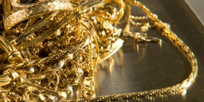 Close up of gold jewelry on a scale ready to be weighed.