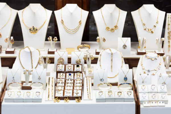 Pendants and bracelets with dimonds on display of jewelry store