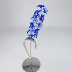 The Swarovski Dindori Sapphire flower shines with vibrant blue crystal petals. A striking addition to the Paradise Flowers Collection. best collateral